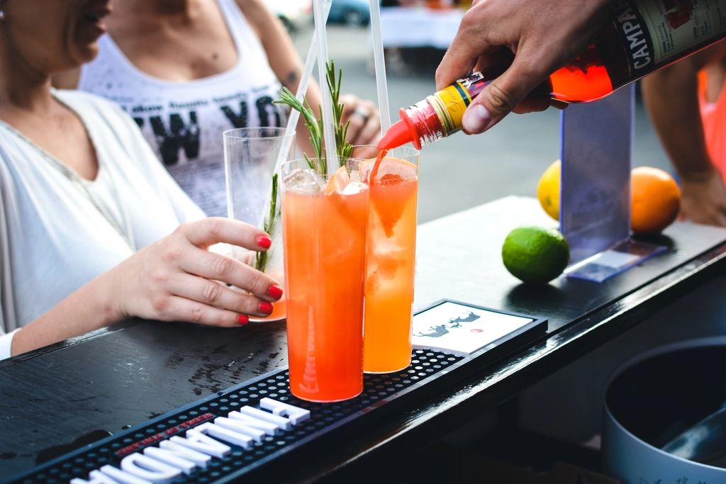 A cocktail being finished at the bar